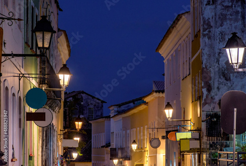 Streets of Pelourinho with its historic colonial-style houses lit at night by old metal lanterns in the state of Bahia, Brazil