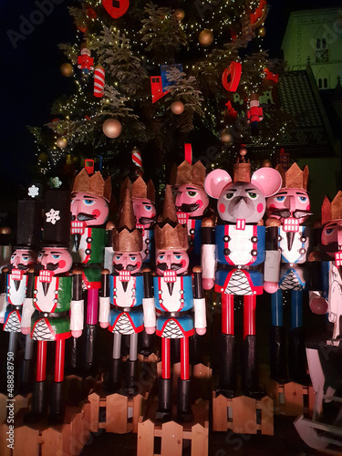 Wooden nutcracker statues standing in a row as a Christmas decoration, night shot