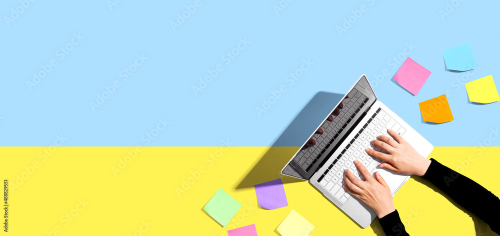 Laptop computer with many sticky notes - Flat lay Laptop computer with many sticky notes - Flat lay