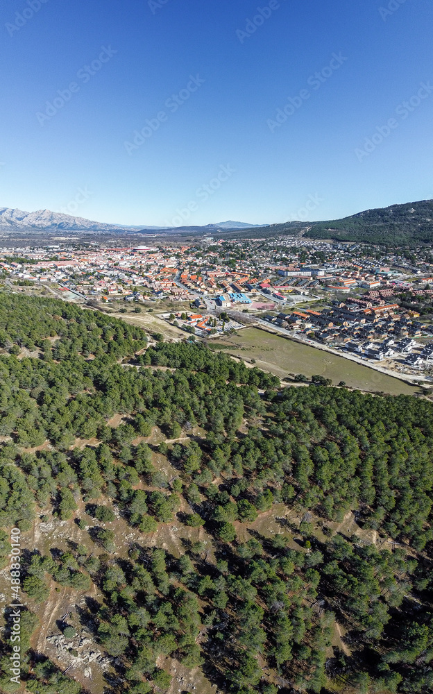 Panoramic view of the village of moralzarzal, surrounded by pine forests, located in the northwestern mountains, in the city of Madrid.