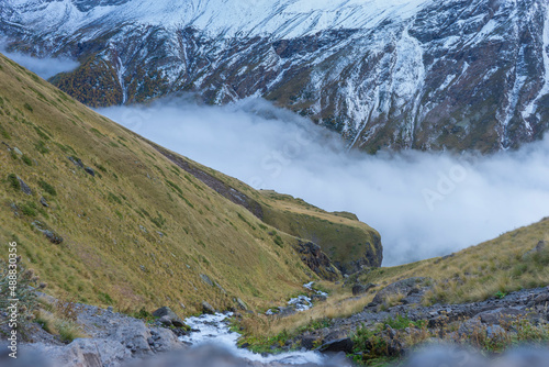 Mountain waterfall in the forest. Waterfall view. Waterfall in mountains. Waterfall pool