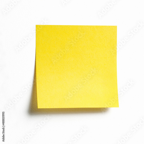 Yellow sticky note isolated on white background, front view adhesive paper with copy space