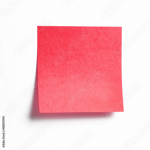 Red sticky note isolated on white background, front view adhesive paper with copy space