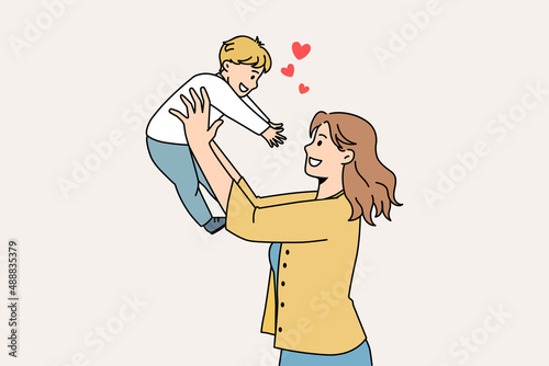Happy parenthood and motherhood concept. Smiling young woman mother standing and holding her small baby boy reaching for her feeling love vector illustration 