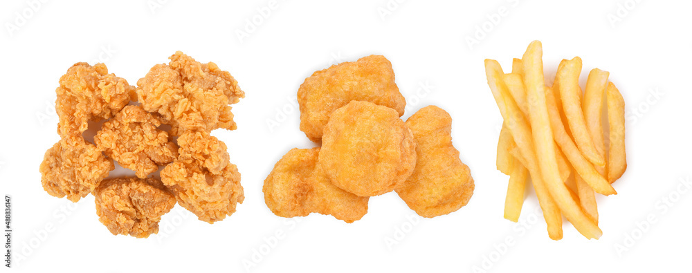 Popcorn chicken, nuggets and french fries isolated on white background. Top view Popcorn chicken, nuggets and french fries isolated on white background. Top view