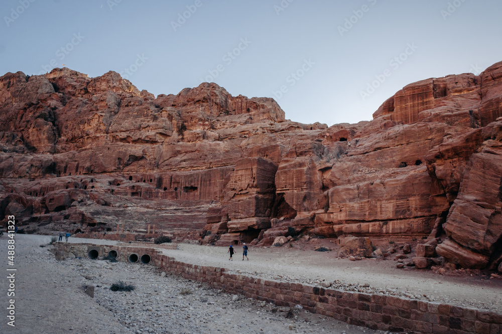 Landscape of Petra. Sunset. Top view of the red mountains and the ruins of Petra. Jordan. Colorful photos. Tourist in Petra