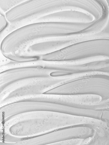 Transparent serum gel texture on white background. Skin care product bubble texture swatch.