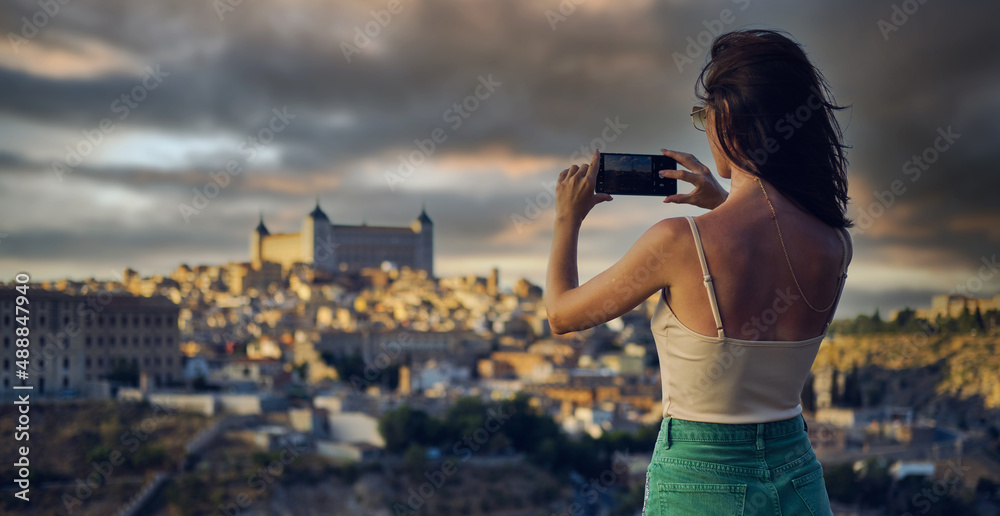 Tourist photographing famous landmarks of Toledo. Spain - obrazy, fototapety, plakaty 