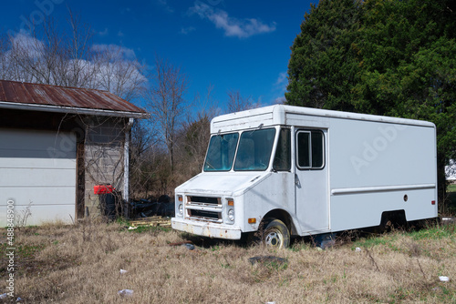 Old Abandoned White Panel Truck With Blank Side For Copyspace