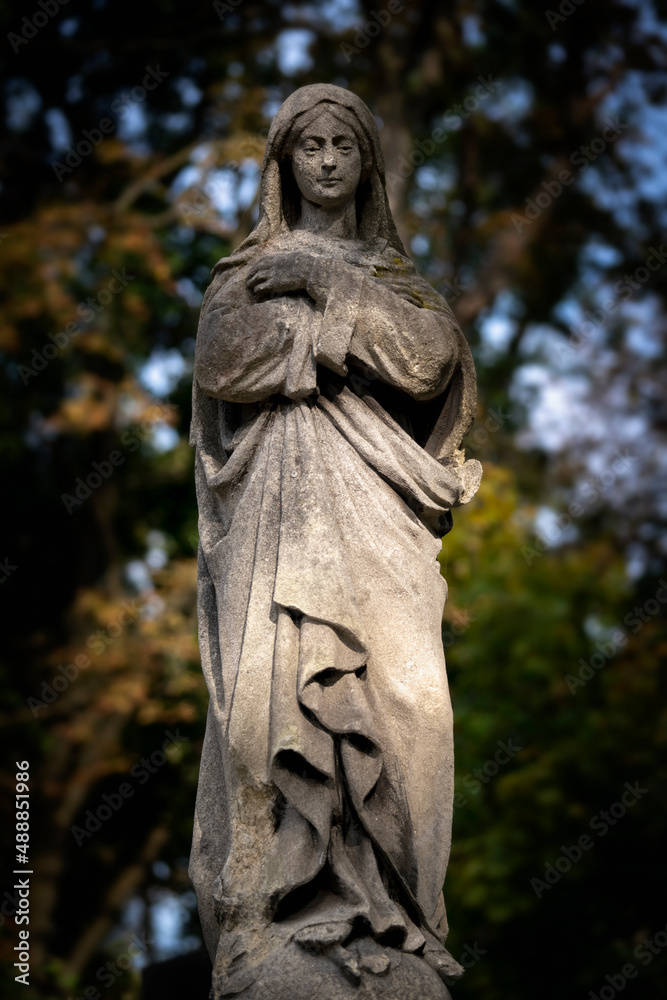 Virgin Mary. An ancient statue. Prayer, faith, religion, love, hope concept