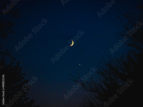 A waning crescent moon in the night sky above Orwell, Ohio
