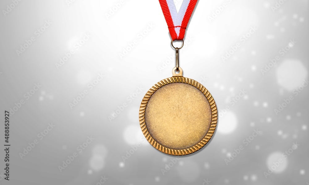 Gold medal of the Olympic Winter Games against the background of snowy nature. - obrazy, fototapety, plakaty 