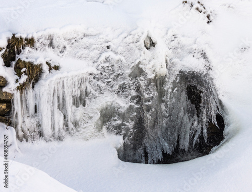 A frozen waterfall on a stream / syke in the North Pennines, Weardale, County Durham photo