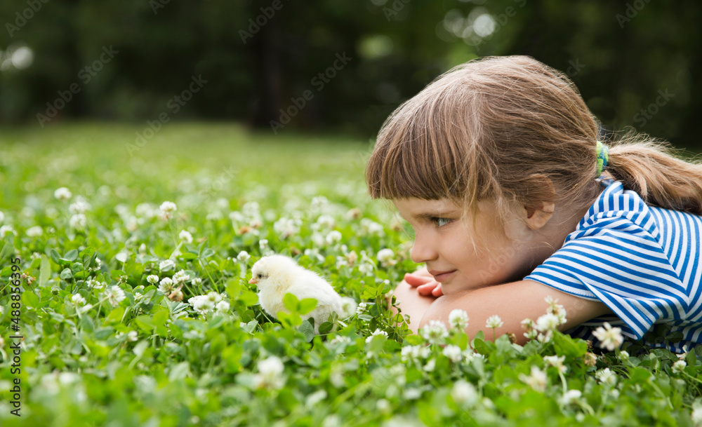 child with chicken against the background of nature. kids summer time on the farm child with chicken against the background of nature. kids summer time on the farm