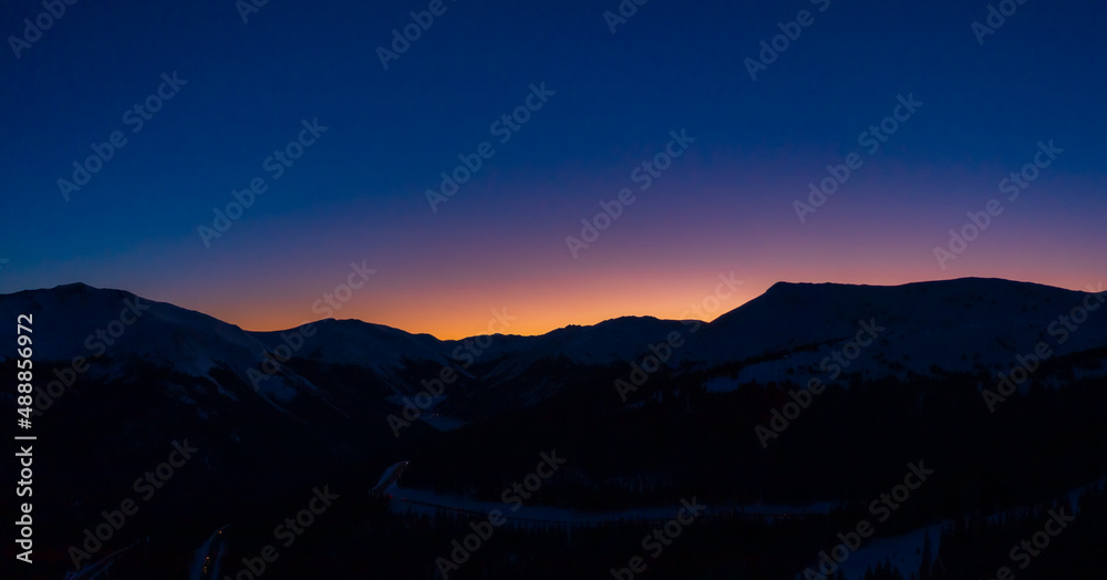 Berthoud Pass mountain range silhouette during sunset in Colorado in Winter