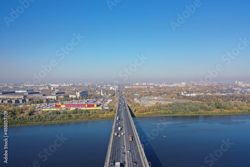 Transport bridge across the river. Nizhny Novgorod, Myzinsky bridge. Aerial photography of the river, and the bridge over the river from a drone.