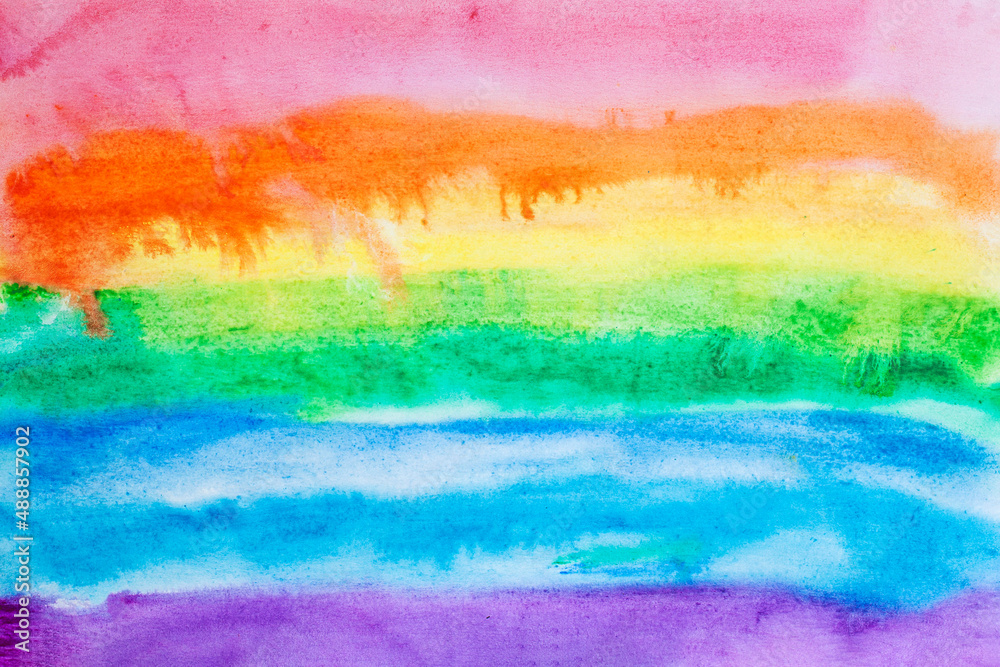 Hand painted abstract watercolor background on paper in rainbow colors