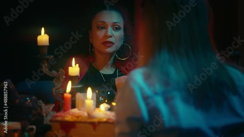 Fortune-teller interpreting tarot cards results, predicting future for customers