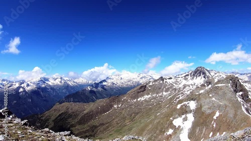 Panoramic view from the summit of mount Reitereck in Carinthia, Maltatal in the Austrian Alps, Central Eastern Alps. Endless snow capped high mountain chains in the High Tauern. Outdoor activity.
 photo