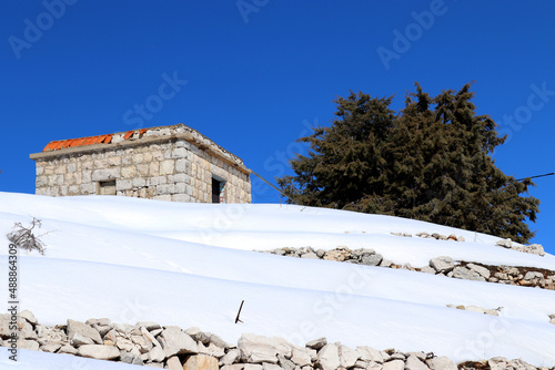 Old Lebanese traditional house under the snow in Qartaba.