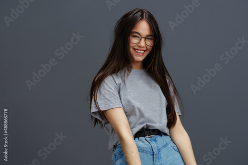 pretty woman in a t-shirt glasses Youth style fun isolated background