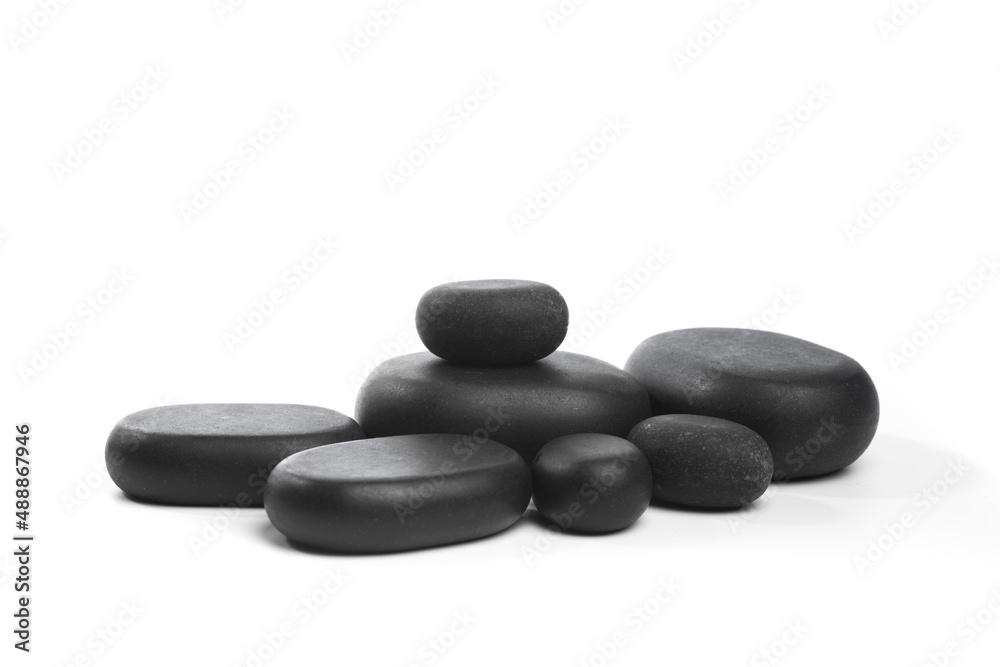 black spa stones isolated on white background . black spa stones isolated on white background .