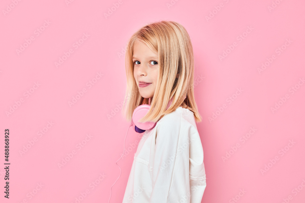 cute girl blonde hair headphones posing pink background cute girl blonde hair headphones posing pink background