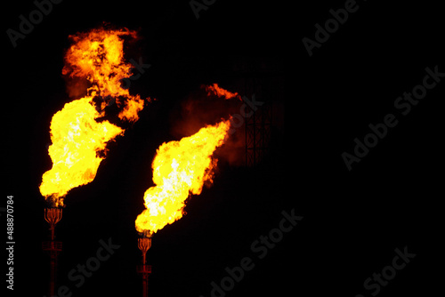 Two isolated gas flares on black background
