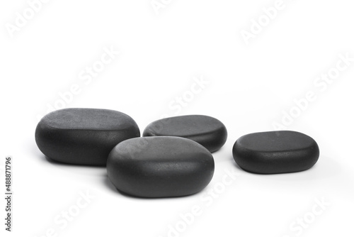 black spa stones isolated on white background .