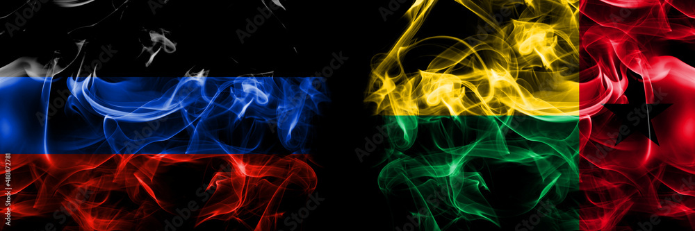 Fototapeta premium Donetsk People's Republic vs Guinea Bissau flag. Smoke flags placed side by side isolated on black background.