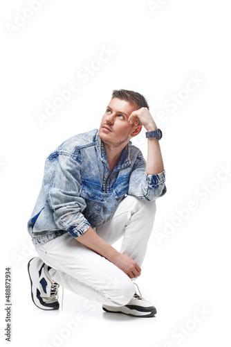 handsome young man in Jean jacket on white background