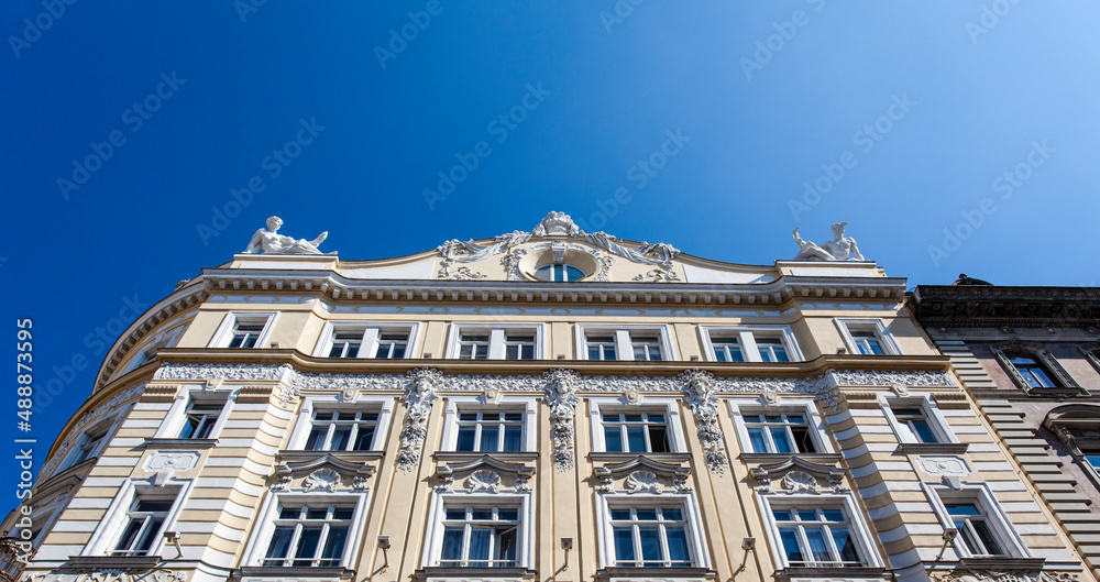 Facade of the ornate historical apartment biulding in the center of Vienna, Austria, Europe