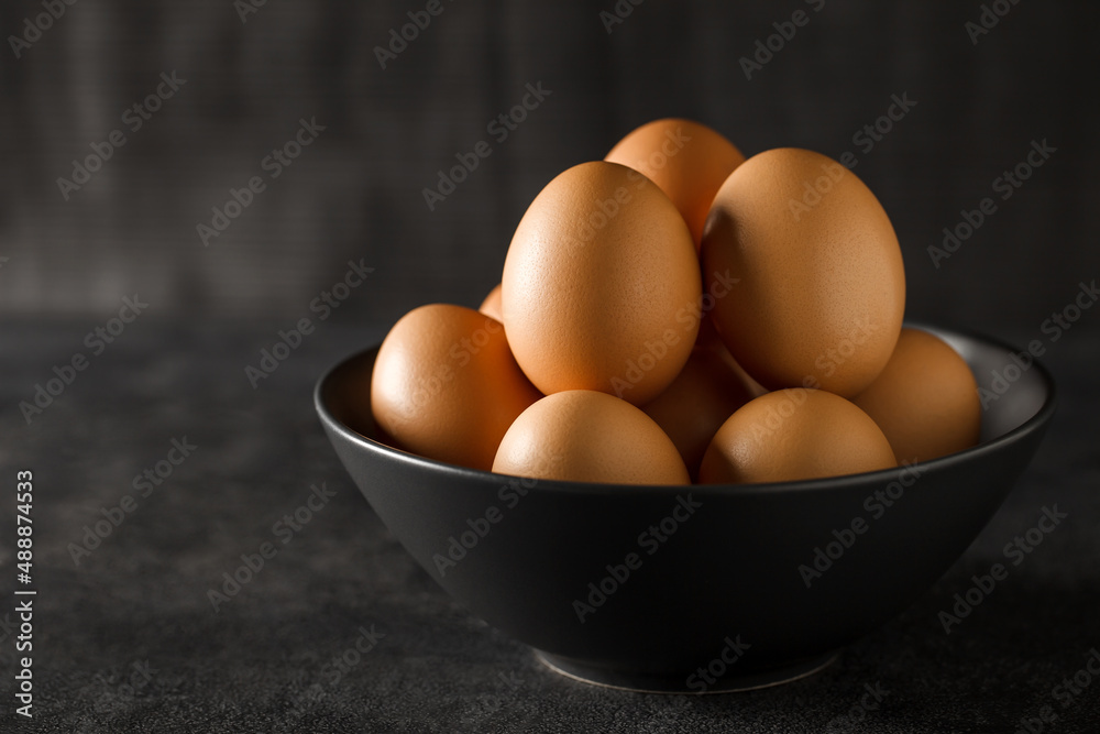 Eggs whole chicken, many stacked in a bowl, selective focus. Eggs whole chicken, many stacked in a bowl, selective focus.