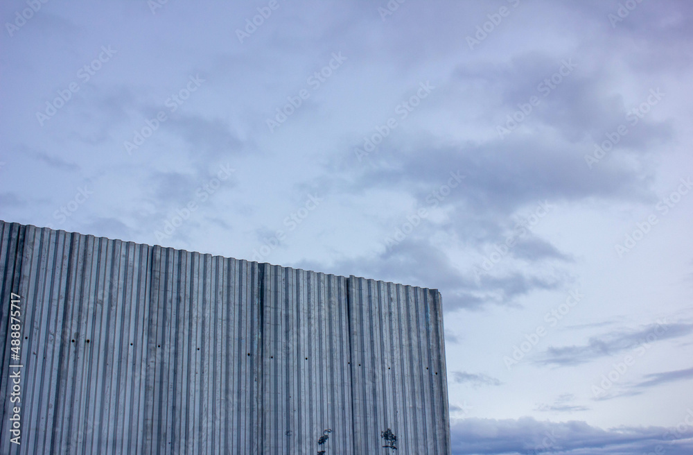 Metal fence close-up. Corrugated metal fence. Decking metal fence. Metal fence close-up. Corrugated metal fence. Decking metal fence.