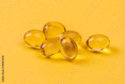 Close up of oil filled capsules suitable for: fish oil, omega 3, omega 6, omega 9, vitamin A, vitamin D, vitamin D3, vitamin E - Image