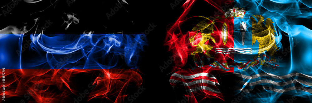Obraz premium Donetsk People's Republic vs Russia, Russian, Ivanovo Oblast flag. Smoke flags placed side by side isolated on black background.