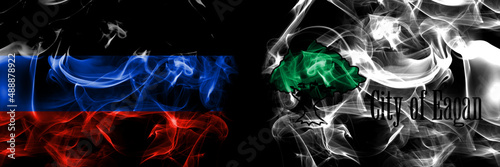 Donetsk People s Republic vs United States of America  America  US  USA  American  Eagan  Minnesota flag. Smoke flags placed side by side isolated on black background.