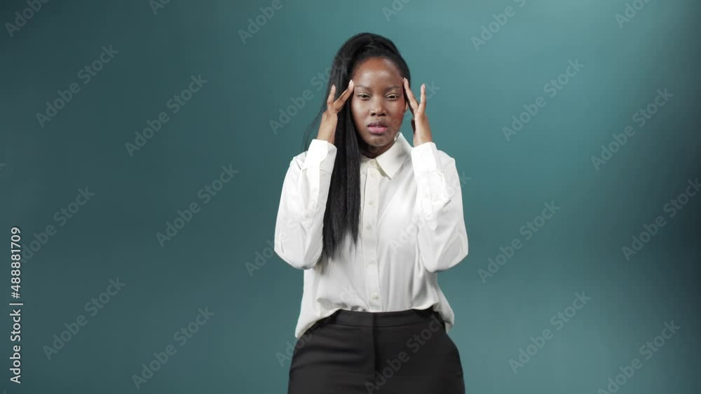 The girl squeezes his eyes tightly, showing despair and poor health The girl squeezes his eyes tightly, showing despair and poor health