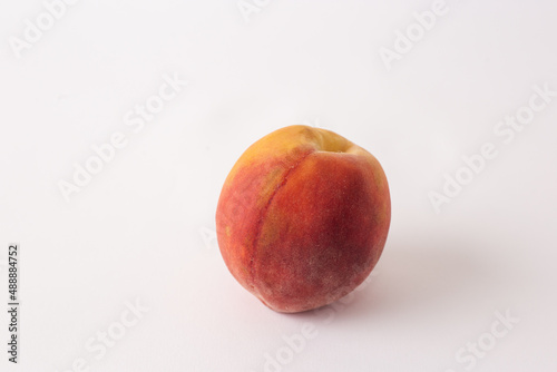 fresh peach on a white meza