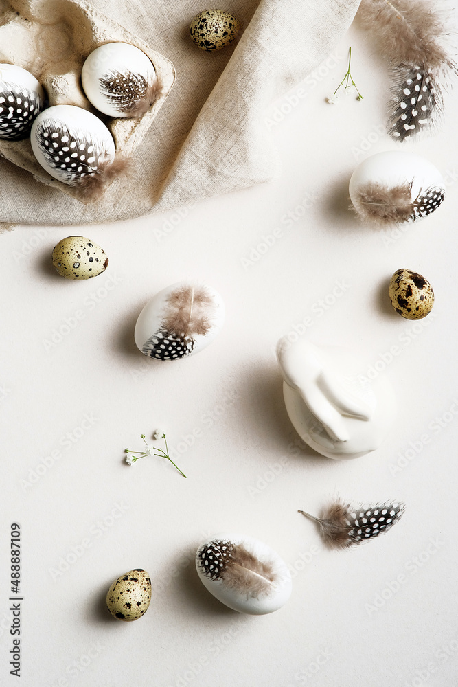 Easter flat lay composition. Easter eggs with feathers on white background. Happy Easter vertical banner. Easter flat lay composition. Easter eggs with feathers on white background. Happy Easter vertical banner.