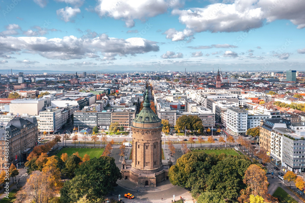 Autumn aerial cityscape of Mannheim city, Baden-Württemberg, Germany. Friedrichsplatz with the Mannheim Water Tower (Wasserturm) in the foreground