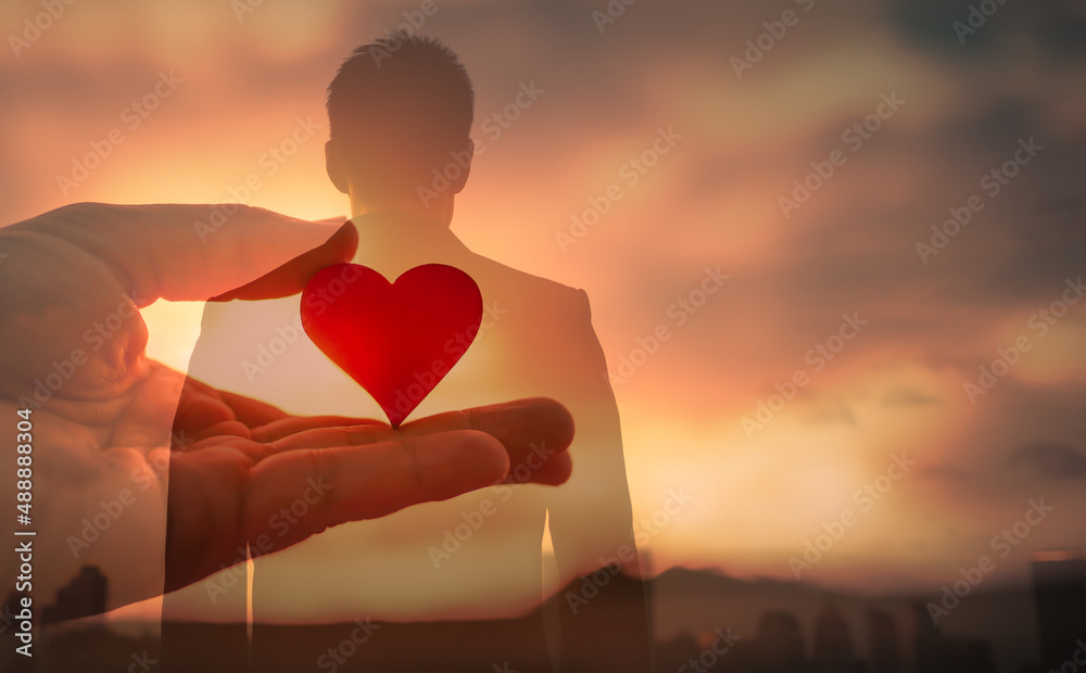Young man with love and compassion in his heart  - obrazy, fototapety, plakaty 