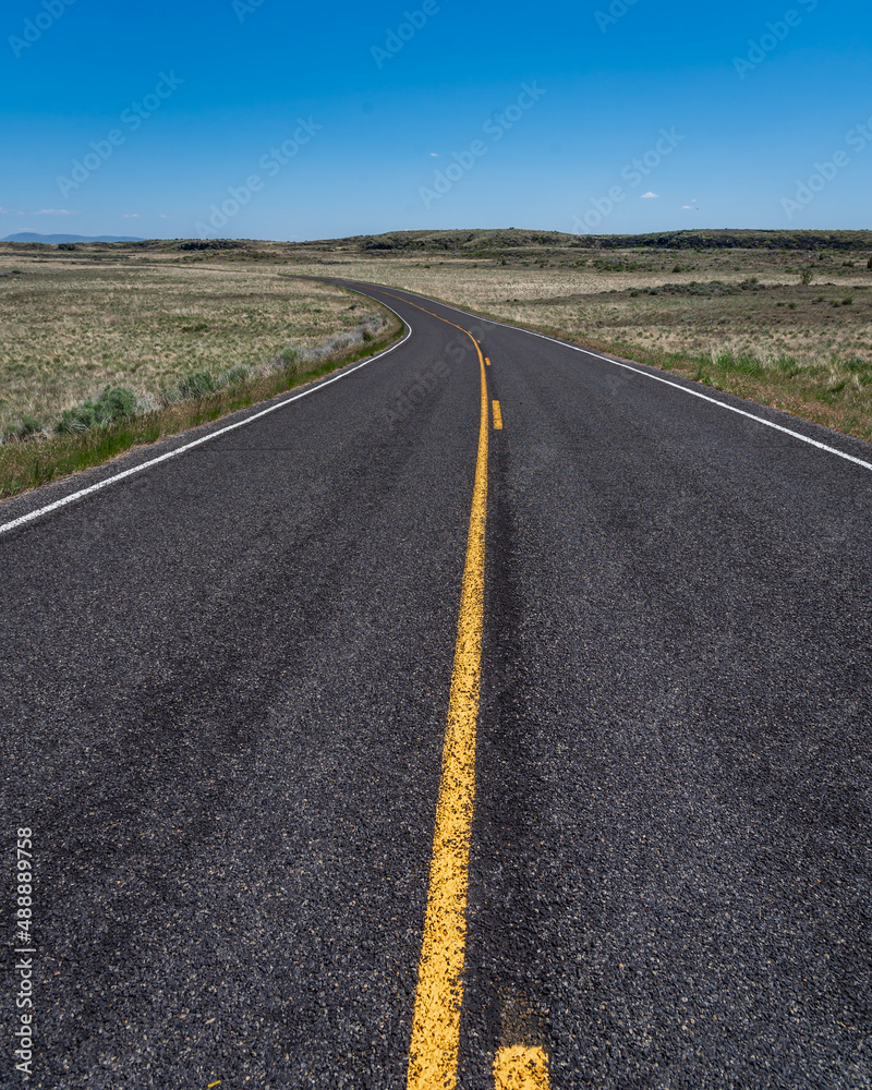 Two lake winding roadway through a juniper forest Two lake winding roadway through a juniper forest