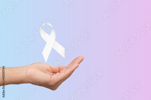 White January, mental health awareness campaign. Woman holding a ribbon.