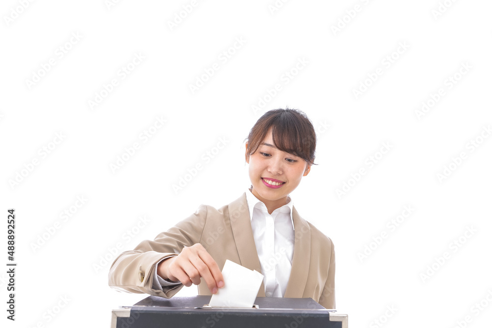 選挙の投票をする有権者 選挙の投票をする有権者