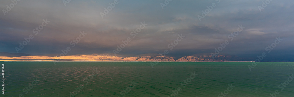 Panorama of the brilliant colors of the Dead Sea and the clouds on a Winter's day in Israel.

