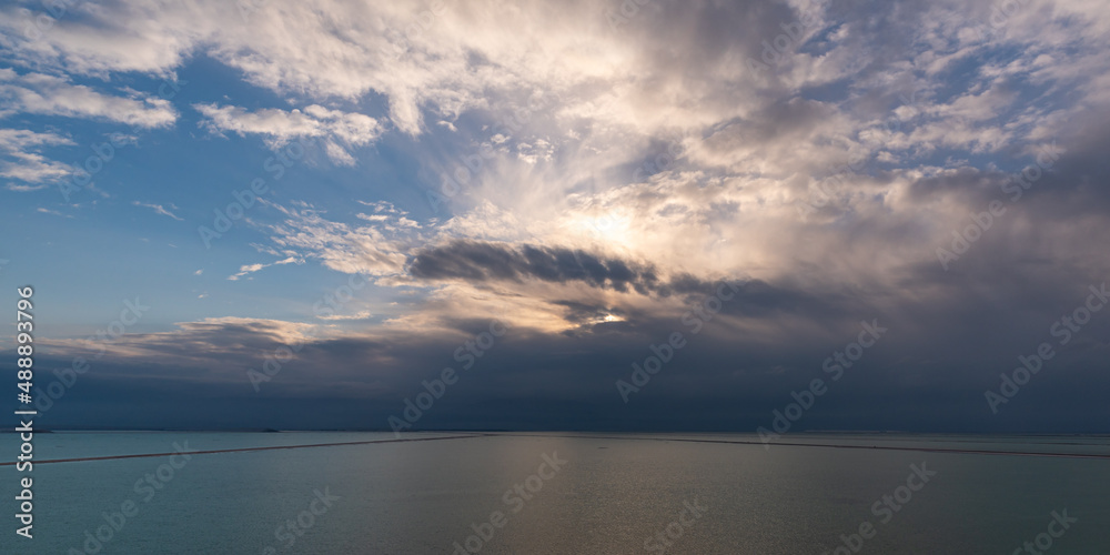 Panorama of the brilliant colors of the Dead Sea and the clouds on a Winter's day in Israel.
