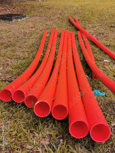 Photo of a bunch industrial undergroud upvc pipes. photo