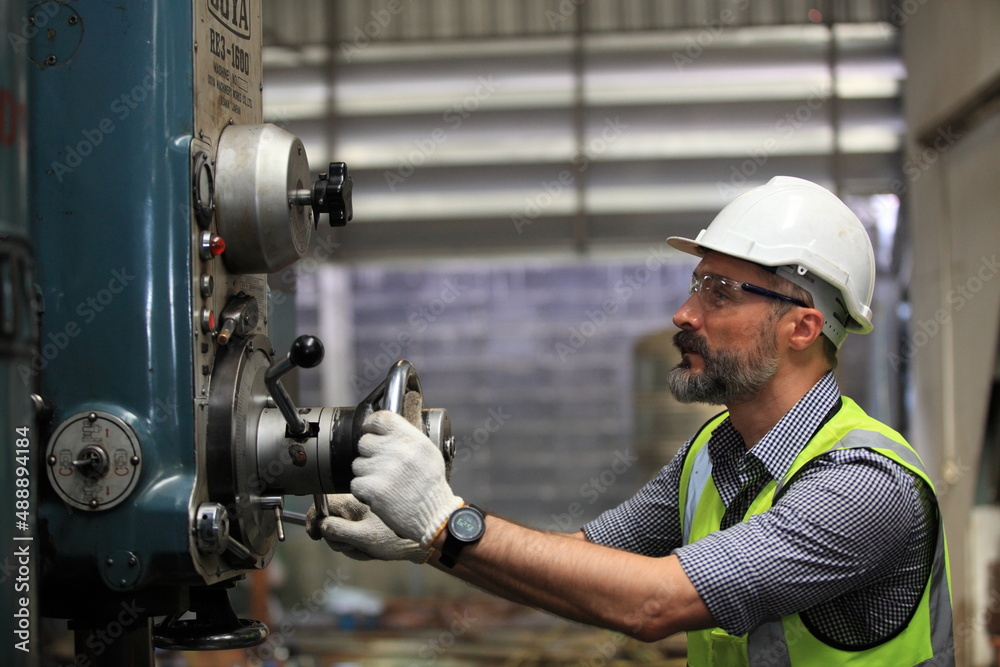 engineer on site working for production or maintenance big machine industry in factory