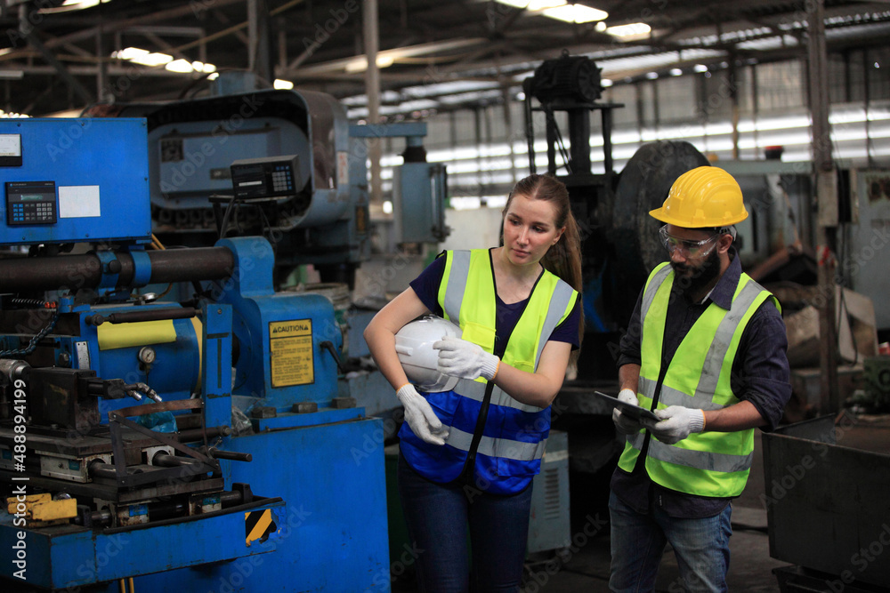 engineer on site working for production or maintenance big machine industry in factory